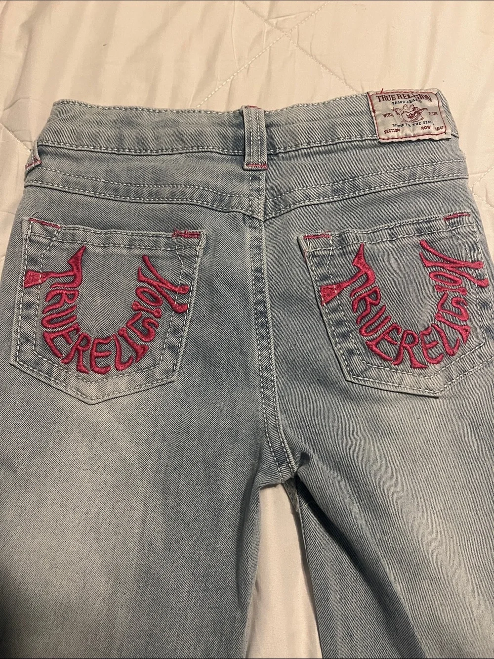 True Religion Light Wash Flare Jeans with Pink Pocket Stitching